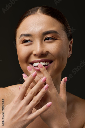Obraz na płótnie Sensual Asian woman embracing beauty and elegance with radiant skin