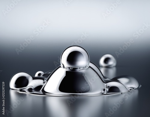 Shiny metallic spheres float on a dark, reflective surface