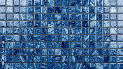 Interior decoration material featuring blue ceramic mosaic tiles.