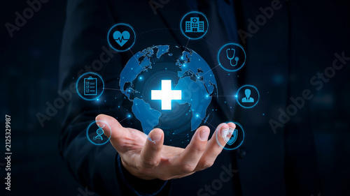 Hand holding a glowing blue globe with healthcare icons orbiting around it anatomy cellular