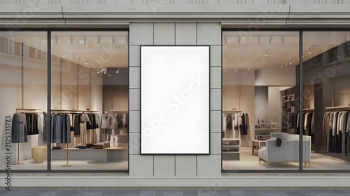 A large vertical blank rectangular billboard frame mounted on a modern boutique storefront exterior, retail advertising mockup