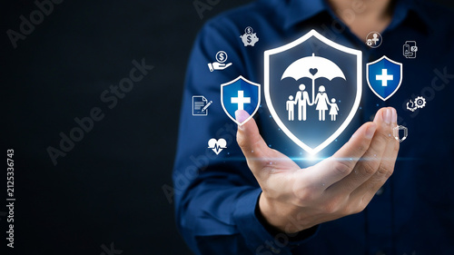 Person holding a shield with family icon and insurance symbols in their hand protection safety
