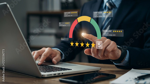 Person interacting with a customer satisfaction rating interface on a laptop review feedback