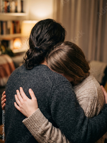 Deep emotional hug providing solace and compassion during sorrowful loss