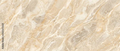 Quadro su tela Marble texture background featuring warm golden onyx stone surface with sweeping