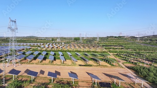 Canvastavla Large scale photovoltaic power station array with transmission towers under clea