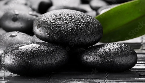 Close Up Of Black Wet Spa Stones Arranged In A Natural Cluster Glistening With Moisture Black Stones