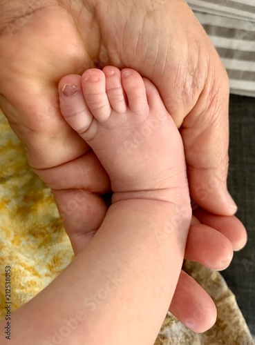 baby foot in fathers hand