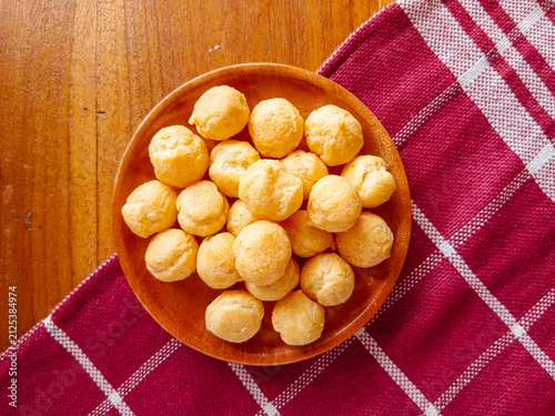 Dry soes cake or Kue soes kering, delicious cheese soes cake in a wooden plate