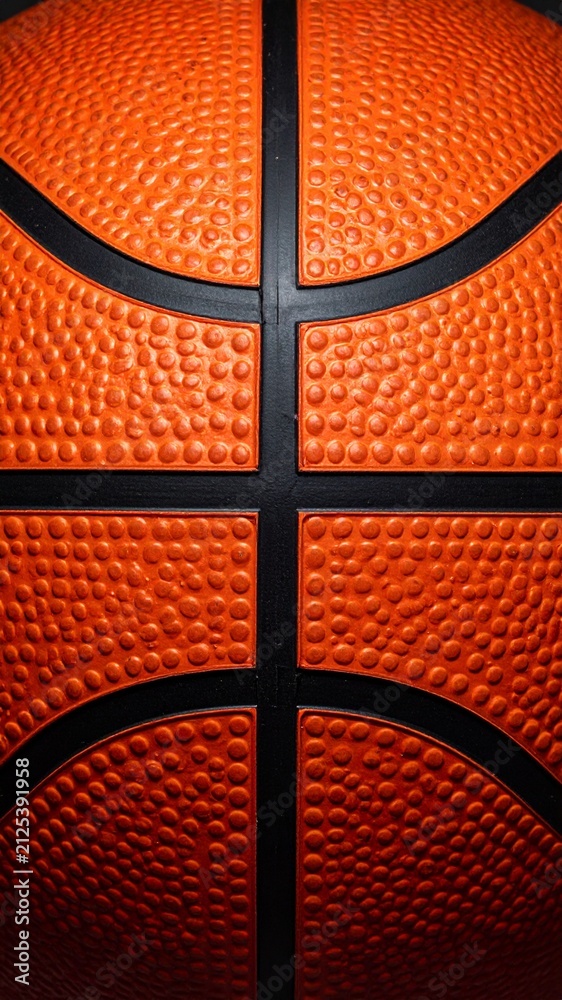 Fototapeta premium Macro Close-up of Basketball Surface Texture and Black Seams
