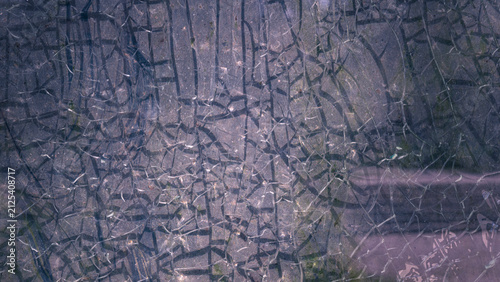 Abstract pattern of cracks on glass