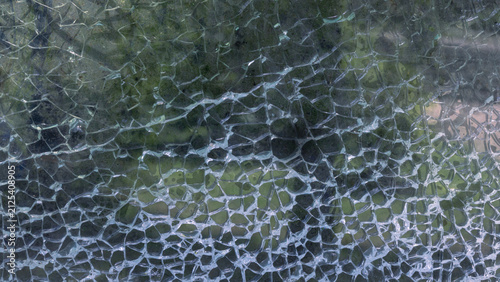 Abstract pattern of cracks on glass