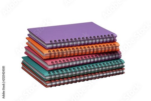 Wide pile of multicolor spiral bound notebooks