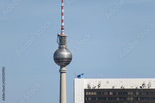 Berlin, Germany - April 23, 2026: The Fernsehturm television tower rises above central Berlin with the Park Inn by Radisson hotel and the Berlin Cathedral seen from the Reichstag rooftop.