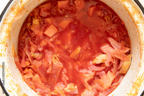 Ukrainian homemade borscht in a pot, a traditional vegetable soup with cabbage, potatoes