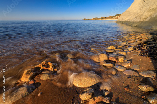 sunrise on the famous Xi beach on the island of Kefalonia in Greece with a stone foreground
