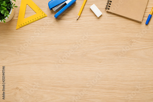 Educational school supplies on wooden desk, creative workspace with stationery and notebook, back to school flat lay with copy space isolated on White Background ai