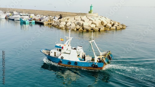 Принти на полотні Trawler fishing boat downloading for the area of fish in the coast of Mediterranean Sea