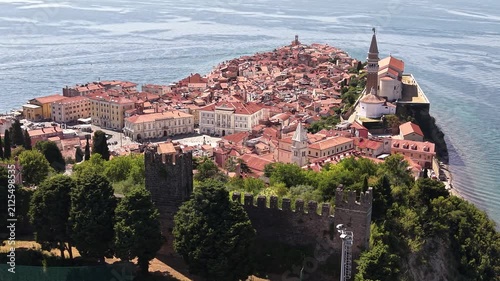 Drone shot of Old Town and ancient city walls in Piran, Slovenia