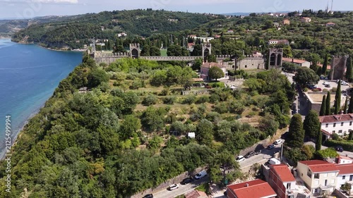 Drone shot of historic town walls overlooking Piran city, Slovenia