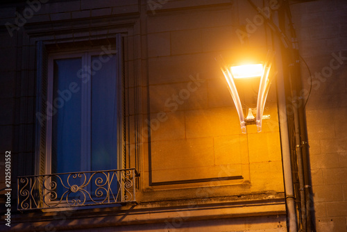 Evening atmosphere with illuminated street lamp and historic architecture