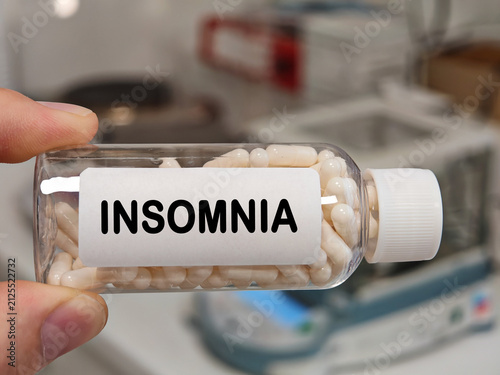 Konstfotografi INSOMNIA capsule medication concept for sleep support insomnia and night time ca