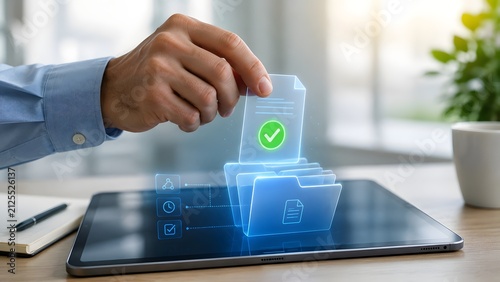 Businessman hand organizing holographic digital documents and folders floating above tablet computer