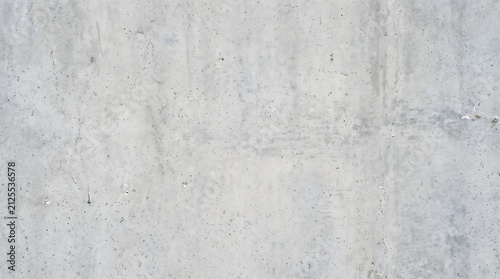Gray concrete wall surface texture with natural pitting concrete industrial background material