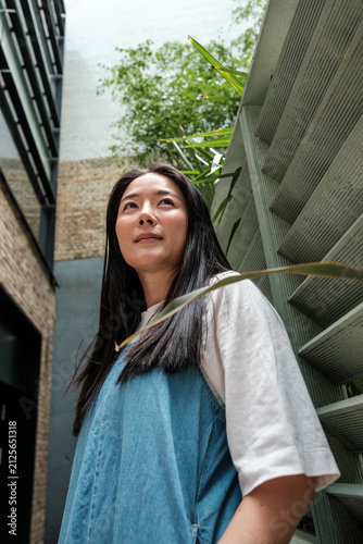 Photography Asian woman looking up finding inspiration outdoors