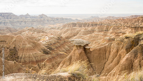 Aerial View of Eroded Badlands Terrain with Unique Rock Formations and Vast Open Spaces