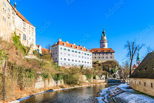 Cesky Krumlov Castle tower and historic castle buildings along Vltava River in winter, Czechia, UNESCO World Heritage Site