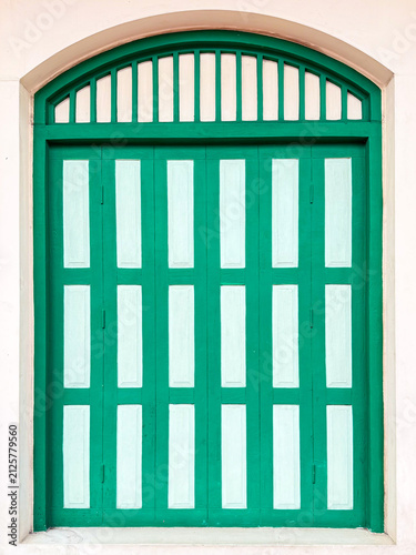 Green window on  white wall