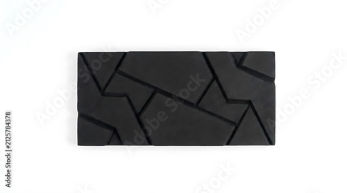 Black rectangular block with engraved geometric line patterns.