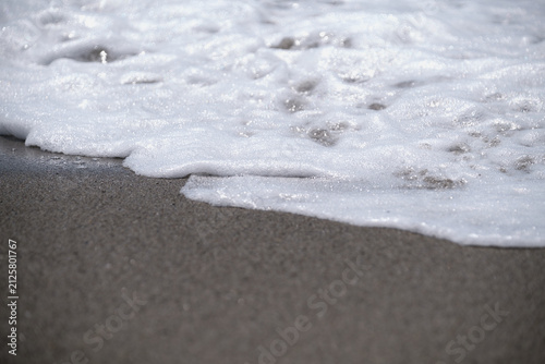 beautiful beach, close up. Top-down aerial view of a clean white sandy beach on the shores of a beautiful sea.