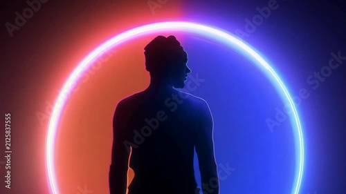 A silhouette of a person standing before a glowing neon arc in a futuristic ambiance. 4k Video footage.