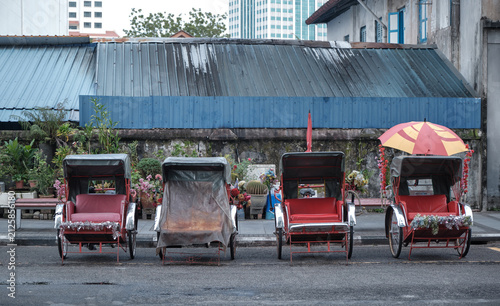 Cuadro en lienzo Traditional trishaws parked along a heritage street in George Town, Penang, Mala