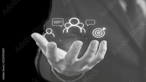 Human hand holding glowing digital business representing communication and target strategy