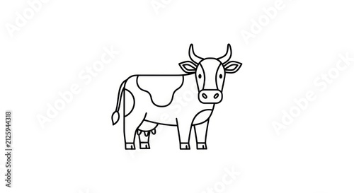 Black and white cow standing still.