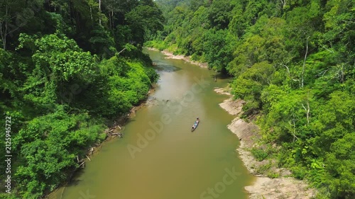 Drone Pull-Away from Longboat Revealing Sungai Tembeling Rainforest, Al-Sultan Abdullah Royal Tiger Reserve, Pahang, Malaysia