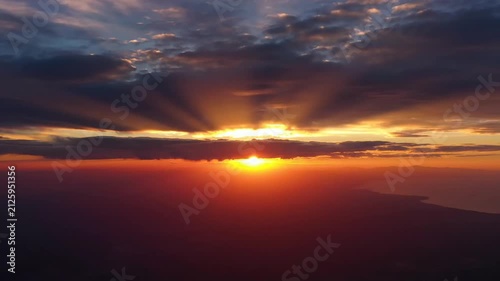 Dramatic Sunset Sky with Sun Rays Over Horizon
