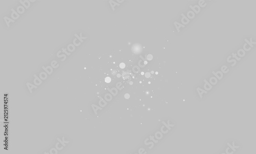 Fotografía Cluster of glowing gray bokeh light circles scattered on a black background in v