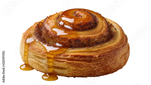 Canvas Print Golden brown cinnamon roll pastry with sweet honey glaze dripping, isolated on t