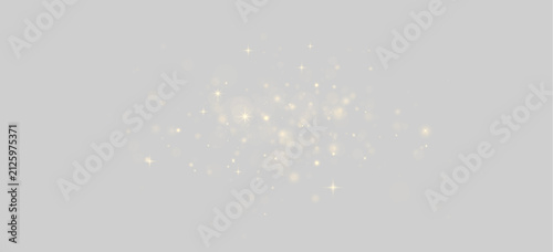 Scattered golden bokeh lights and sparkling starbursts on a black background on transparent background