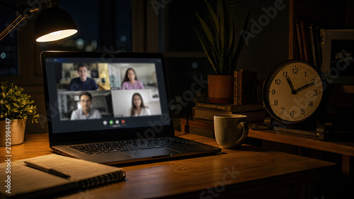 Expat autumn homesickness. Close-up of a laptop screen showing blurred video call interface at a desk