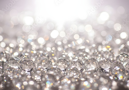 Sparkling diamond beads with glittering bokeh light effect background
