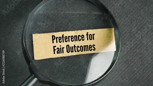 Fotografie Magnifying glass with the words Preference for Fair Outcomes