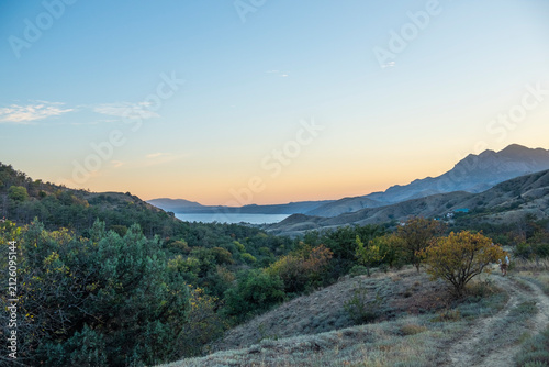 Beautiful sunset over Kara Dag Mountain in Crimea, overlooking the Black Sea.