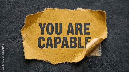 Torn paper sign saying you are capable