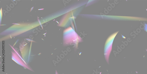 Scattered translucent prism fragments casting multicolored spectral light on black background on transparent background