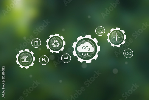 Carbon reduction and renewable energy gear icons concept on green background.